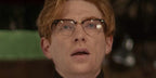 Domhnall Gleeson was seen wearing black Ray-Ban Clubmaster Optical RB 5154 2000 half-rim optical glasses in Apple TV+ 2025 movie "Fountain of Youth"