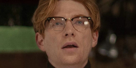 Domnhall Gleeson was seen wearing black Ray-Ban Clubmaster Optical RB 5154 2000 half-rim optical glasses in Apple TV+ 2025 movie "Fountain of Youth"