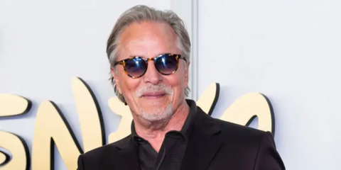 Don Johnson is seen wearing spotted tortoiseshell Garrett Leight Carlton 2107 ECO SPT/ECO MG sunglasses with blue gradient lenses to attend the 2024 Disney Upfront at Javits Center in New York City