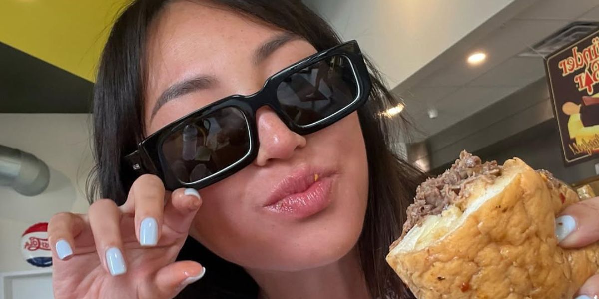 Dorothy Wang wears Prada PR 06YS 09Q5S0 sunglasses in her Instagram post