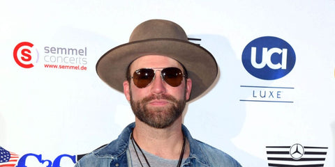 American country singer Drake White was seen wearing gold Ray-Ban Aviator 3025 001/57 sunglasses with brown Polarised lenses at the C2C Country to Country Festival in Berlin, Germany, March 2019.