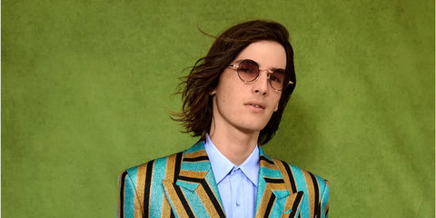 Son of Pierce Brosnan, Dylan Brosnan was seen wearing gold and black Matsuda Sun 10601H RG-MBK Special Edition round sunglasses with Pink Gradient lenses in a GQ Magazine feature, September 2022. Shop online now on Pretavoir