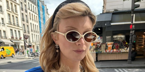 Dylan Mulvaney was seen wearing white Miu Miu MU 04ZS 14240D round sunglasses in her Instagram post