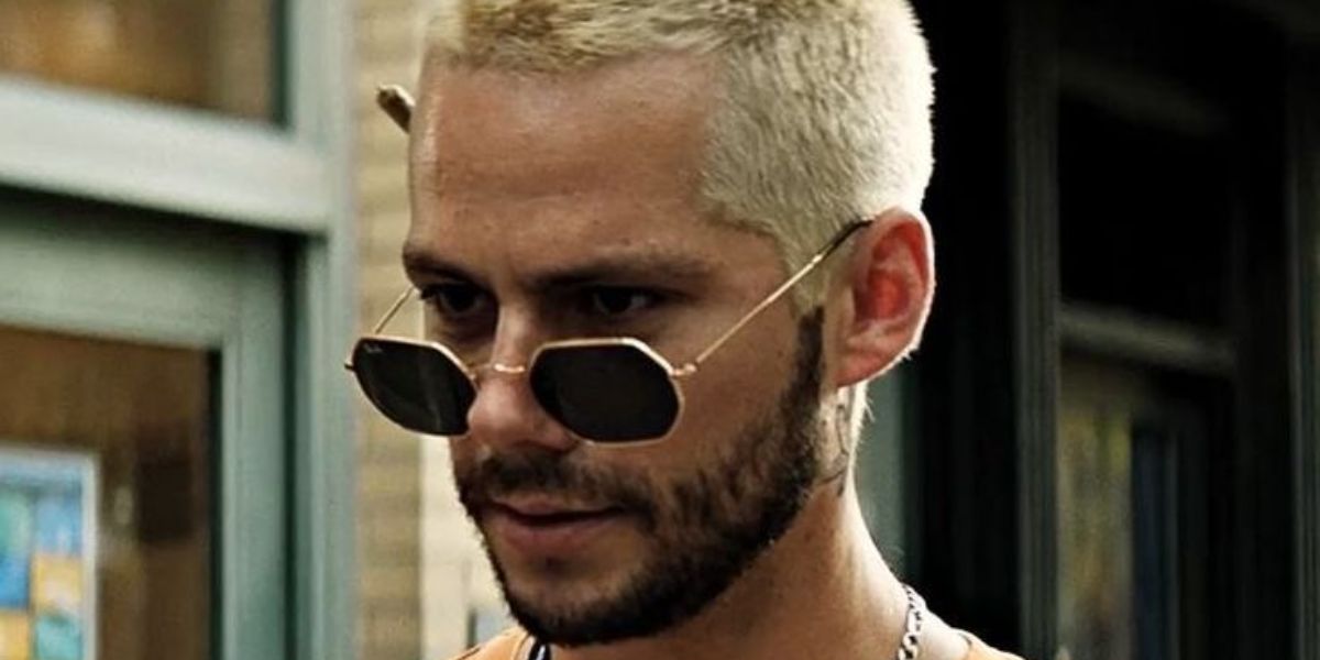 Dylan O'Brien was seen wearing gold Ray-Ban Octagonal RB 3556N 001 sunglasses in 2022 movie Not Okay