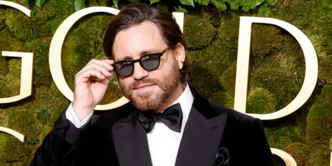 Edgar Ramirez was seen wearing black Garrett Leight Mr. Leight James S ML2050 BK-GM/BRITTBLU Limited Edition sunglasses with blue lenses to the 2025 Golden Globe Awards