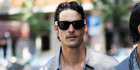 Spanish model Edu Roman was seen wearing black Ray-Ban Mega Wayfarer RB 0840S 901/58 Polarised sunglasses at the Giorgio Armani Menswear Spring/Summer 2026 fashion show during Milan Men's Fashion Week.