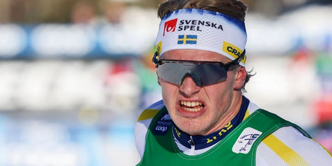 Swedish cross-country skier Edvin Anger was seen wearing black Oakley Encoder Strike Vented OO9235 01 Prizm sunglasses