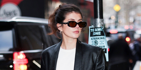 Emily Bader was seen wearing black Coach CBY84 HC8443D 5002/73 sunglasses with quilted temple and C logo details at the Coach Fall/Winter 2026 fashion show during New York Fashion Week.