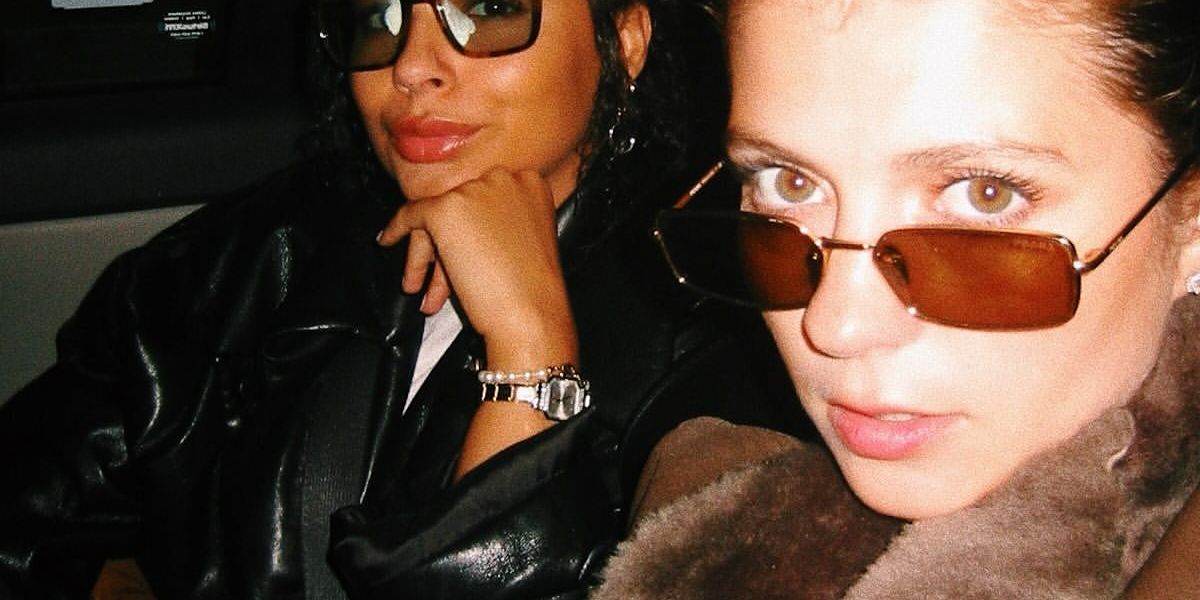 Actress Emily Bader was seen wearing gold Prada PR A60S 5AK70G rectangular sunglasses in her Instagram post, April 2026.