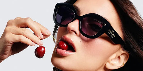Emily Ratajkowski was seen wearing black Marc Jacobs The Sunglasses Marc 800/S MNG9O cat-eye sunglasses in the Marc Jacobs Eyewear Spring/Summer 2025 campaign.