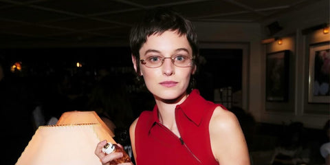 Emma Corrin was seen wearing Miu Miu MU 53WV 5AK1O1 rimless oval sunglasses at the launch of Miutine fragrance by Miu Miu in London, September 2025.