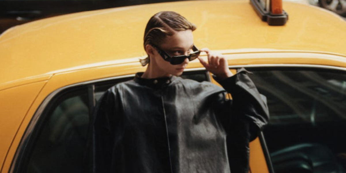 Emma Myers was seen wearing black Prada PR 27ZS 16K08Z rectangular sunglasses in a fashion editorial page of Harper's Bazaar Taiwan, May 2023