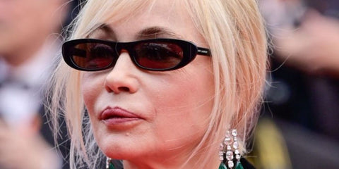 Emmanuelle Beart was seen wearing black Saint Laurent Sun SL 557 Shade 001 thin cat eye sunglasses to attend the "Le Deuxième Acte" ("The Second Act") screening & opening ceremony red carpet at the 2024 annual Cannes Film Festival