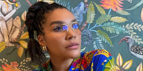 Emmy Raver-Lampman was seen wearing gold Ray-Ban RB 6489 2500 aviator optical glasses in her Instagram post, June 2022. Shop online now on Pretavoir