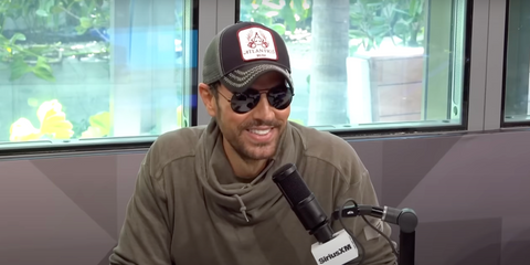 Enrique Iglesias is seen wearing Ray-Ban Aviator Large Metal RB 3025 002/48 Polarised sunglasses with black frame in an interview with SiriusXM, May 2024