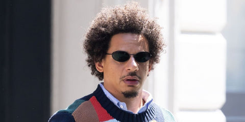 Actor and comedian Eric Andre was seen wearing black Prada PR A59S 1AB60G sunglasses in New York City, August 2025.