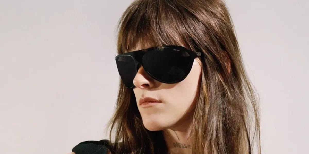 Singer-songwriter Ethel Cain was seen wearing black Miu Miu MU A01S 1AB5S0 sunglasses in the Miu Miu campaign.