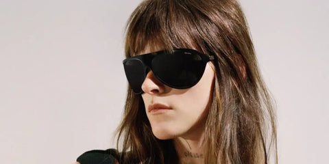 Singer-songwriter Ethel Cain was seen wearing black Miu Miu MU A01S 1AB5S0 sunglasses in the Miu Miu campaign.