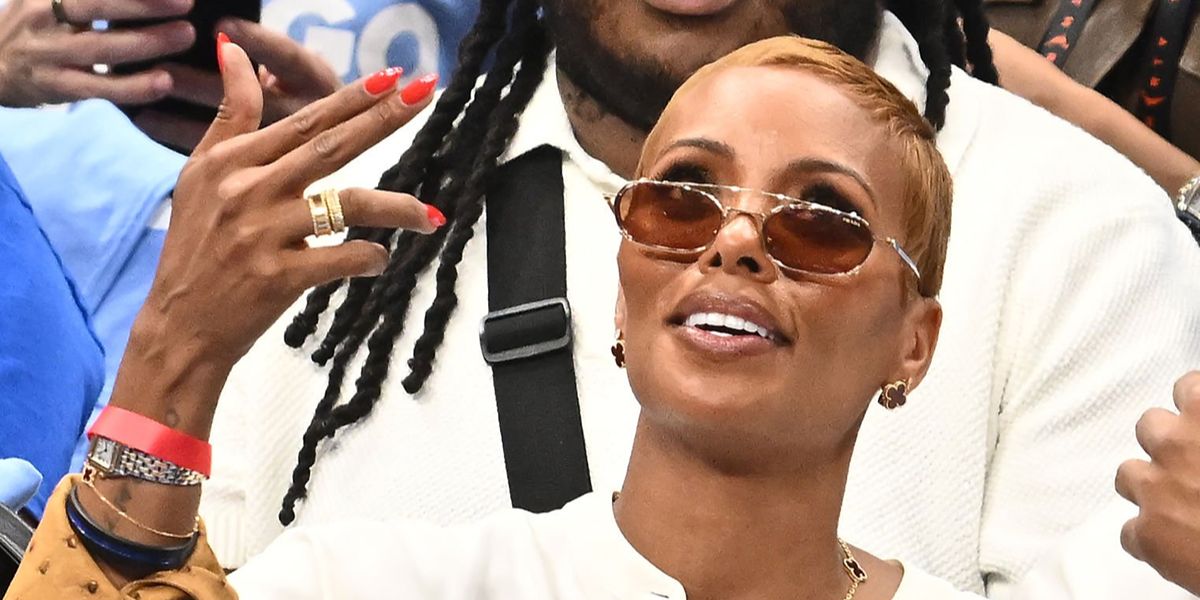 Model and actress Eva Marcille wore silver Prada PR D59S 1BC50P sunglasses with brown lenses at the WNBA Final Match in October 2026.