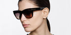 Female model wears Tom Ford TF1343 52T brown cat eye sunglasses