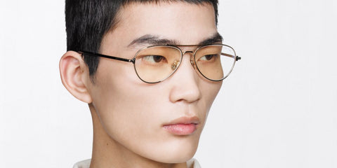Male model wears Tom Ford TF6128-B 028 Blue Control aviator metal glasses