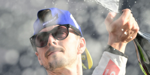 Italian motorcycle racer Fabio DI Giannantonio was seen wearing black Oakley Meta Hstn OW8002 02 Transitions Smart Glasses during a celebration as he finished third at the MotoGP of Valencia 2025.