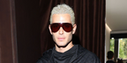 Fai Khadra wore brown Gucci GG2271S 006 shield sunglasses at the Gucci Spring/Summer 2027 show during Milan Fashion Week.