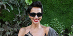 Algerian-French model Farida Khelfa was seen wearing black Balmain B Spirit BPS-179A sunglasses at the Jean Paul Gaultier Spring/Summer 2026 fashion show during Paris Fashion Week.