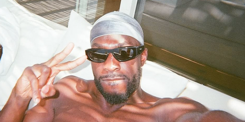 Footballer Fikayo Tomori of AC Milan FC was seen wearing black Prada PR B19S 16K08Z sunglasses in Mykonos, Greece, shared through his Instagram post in June 2025.