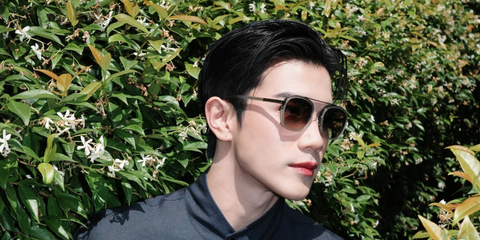 Thai actor Fourth Nattawat was seen wearing grey Zegna Orizzonte I EZ0231 20F sunglasses with brown gradient lenses at the Zegna Spring/Summer 2025 fashion show during Milan Men's Fashion Week. Shop online now on Pretavoir