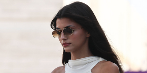 Portuguese actress and girlfriend of Formula racer Francisca Cerqueira Gomes was seen wearing gold Ray-Ban RB 3719 001/51 sunglasses with brown gradient lenses at the F1 Grand Prix of Qatar 2025.