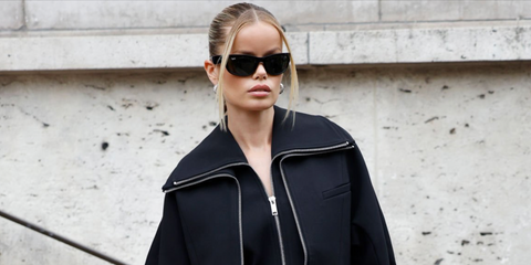 Norwegian model Frida Aasen was seen wearing black Ray-Ban Mega Balorama RB 2289 901/31 sunglasses to attend the Ganni Spring/Summer 2025 fashion show during Paris Fashion Week