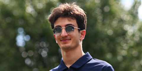 Italian racer Gabriele Mini was seen wearing silver Ray-Ban New Round RB 3637 003/3F sunglasses with blue gradient lenses at the Formula 2 championship in Melbourne, March 2025.