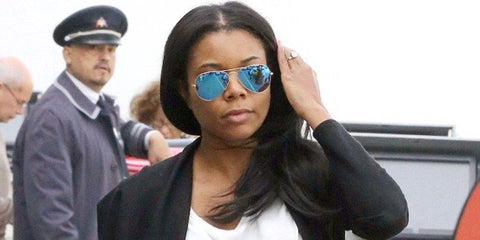 Gabrielle Union was seen wearing Ray-Ban Aviator 3025 112/17 Blue Flash Mirror sunglasses