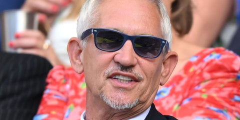 Former football legend Gary Lineker was seen wearing blue and transparent Ray-Ban New Wayfarer 2132 605371 sunglasses at the Wimbledon Tennis Championships 2025. Shop online now on Pretavoir