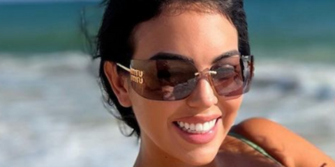 Georgina Rodriguez wearing Miu Miu rimless runway sunglasses while on family holiday