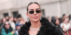 Georgina Rodriguez was seen wearing silver Gucci GG1221S 008 sunglasses with brown lenses at the Gucci Fall/Winter 2026 fashion show during Milan Fashion Week.