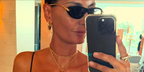 Fashion editor and creative director Giovanna Battaglia was seen wearing black and gold Bottega Veneta BV1390S 001 knot sunglasses in her Instagram post, August 2025.