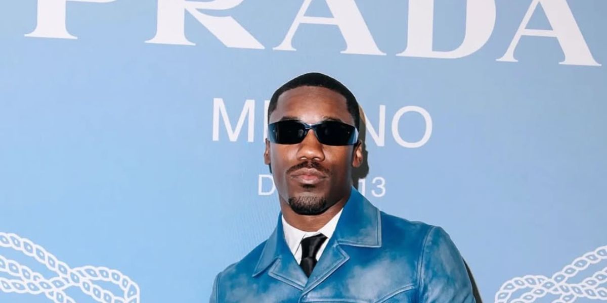 Giveon was seen wearing black Prada PR A14S 1AB5S0 wraparound sunglasses at the opening of Prada Menswear Fifth Avenue in New York City, May 2025