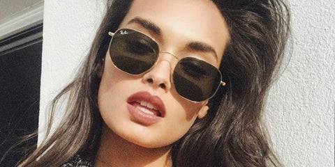 Brazilian model Gizele Oliveira was seen wearing Ray-Ban RB 3548N 001 Hexagonal Gold With Flat Lenses sunglasses