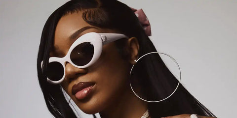 GloRilla was seen wearing white Versace 4456U 314/1 cat eye sunglasses in the cover story of Vibe.com July 2024 digital issue