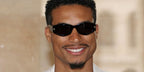 Top Gun: Maverick actor Greg Tarzan Davis was seen wearing black Givenchy GV40062I 01A sunglasses at the Givenchy Menswear Spring/Summer 2024 fashion show during Paris Men's Fashion Week