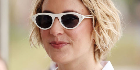 Greta Gerwig was seen wearing white Prada PR B15S 17K80R sunglasses at the Venice Film Festival 2025. Shop online now on Pretavoir
