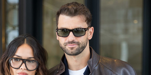 Bulgarian tennis player Grigor Dimitrov, pictured with girlfriend Eiza Gonzalez, was seen wearing tortoiseshell Prada PR B11S 17N20G sunglasses with green Polarised lenses at the Prada Spring/Summer 2026 fashion show during Milan Fashion Week. Shop online now on Pretavoir