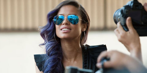 Gugu Mbatha-Raw was seen wearing Ray-Ban Aviator 3025 112/17 Blue Flash Mirror sunglasses