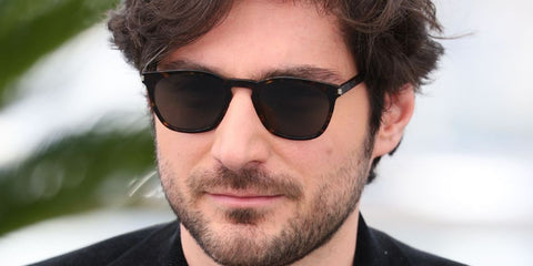 French movie director Guillaume Marbeck was seen wearing tortoiseshell Saint Laurent Sun SL 28 Slim 003 sunglasses with grey lenses at the Cannes Film Festival 2025. Shop online now on Pretavoir