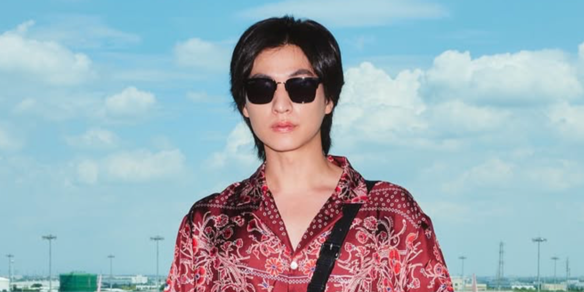 Thai actor and celebrity Gulf Kanawut was seen wearing black and gold Gucci GG1226S 001 half-rim sunglasses with brown lenses in his Instagram post, September 2025.