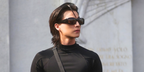 Thai actor Gulf Kunawut was seen wearing black Gucci GG2273S 001 wraparound sunglasses at the Gucci Fall/Winter 2026 fashion show during Milan Fashion Week.