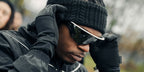 Gunna was seen wearing white Oakley Meta Vanguard OW8001 05 Smart Glasses with prizm black lenses in his Wunna Run 5K promotion post on Instagram
