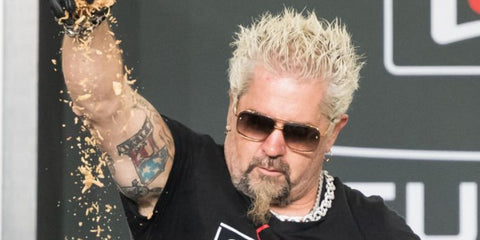 Guy Fieri was seen wearing Dita Mach Six DTS121 03 Black Iron and Black Rhodium square sunglasses at the Grand Tasting Village during the 2025 South Beach Wine & Food Festival in Florida